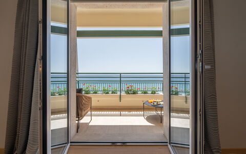Dimora Mareblu 6: Floor, Door, Home Door, Glass, Shade, Wood Stain, Hardwood, Chair, Balcony