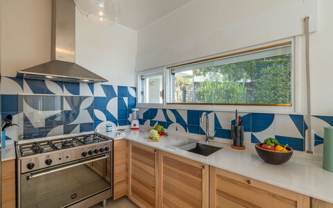 Casa Chiara 6+2: Kitchen, Countertop, Tile, Wood Stain, Natural Material, Major Appliance, Paint, Kitchen Appliance, Kitchen Stove, Plank