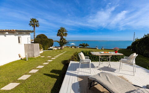Baia L'Aura 8: Blue, Sea, Ocean, Coast, Coastal And Oceanic Landforms, Shore, Lawn, Shade, Beach, Tropics