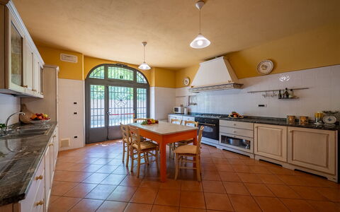 Podere Sant'Eugenio 14: Interior Design, Kitchen, Flooring, Furniture, Countertop, Ceiling, Floor, Light Fixture, Lighting, Cabinetry