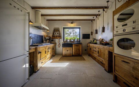 I Tramonti 10+2: Kitchen, Countertop, Wood, Cabinetry, Kitchen Appliance, Major Appliance, Furniture, Kitchen Stove, Flooring, Interior Design