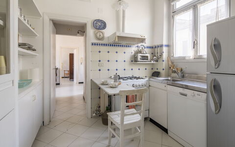 La Terrazza in Centro, Genova: Flooring, Interior Design, Floor, Kitchen, Furniture, Ceiling, Countertop, Major Appliance, Cabinetry, Kitchen Appliance