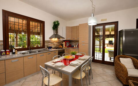 Villa Patrizia: Furniture, Interior Design, Kitchen, Flooring, Countertop, Chair, Wood, Kitchen & Dining Room Table, Table, Home