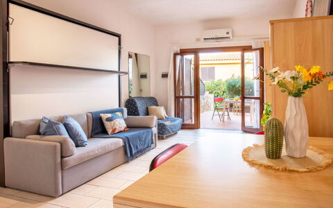 Golfo di Marinella 300: Furniture, Interior Design, Wood, Flooring, Apartment, Couch, Floor, Room, Living Room, Table