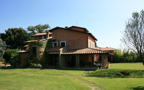 Villa Iris: Sky, Plant, Building, Window, Tree, House, Natural Landscape, Land Lot, Grass, Cottage