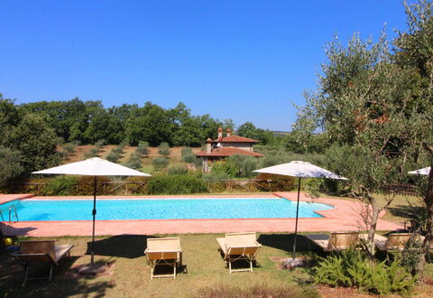 La Casetta nel Bosco: Plant, Water, Property, Sky, Umbrella, Swimming Pool, Azure, Shade, Tree, Outdoor Furniture